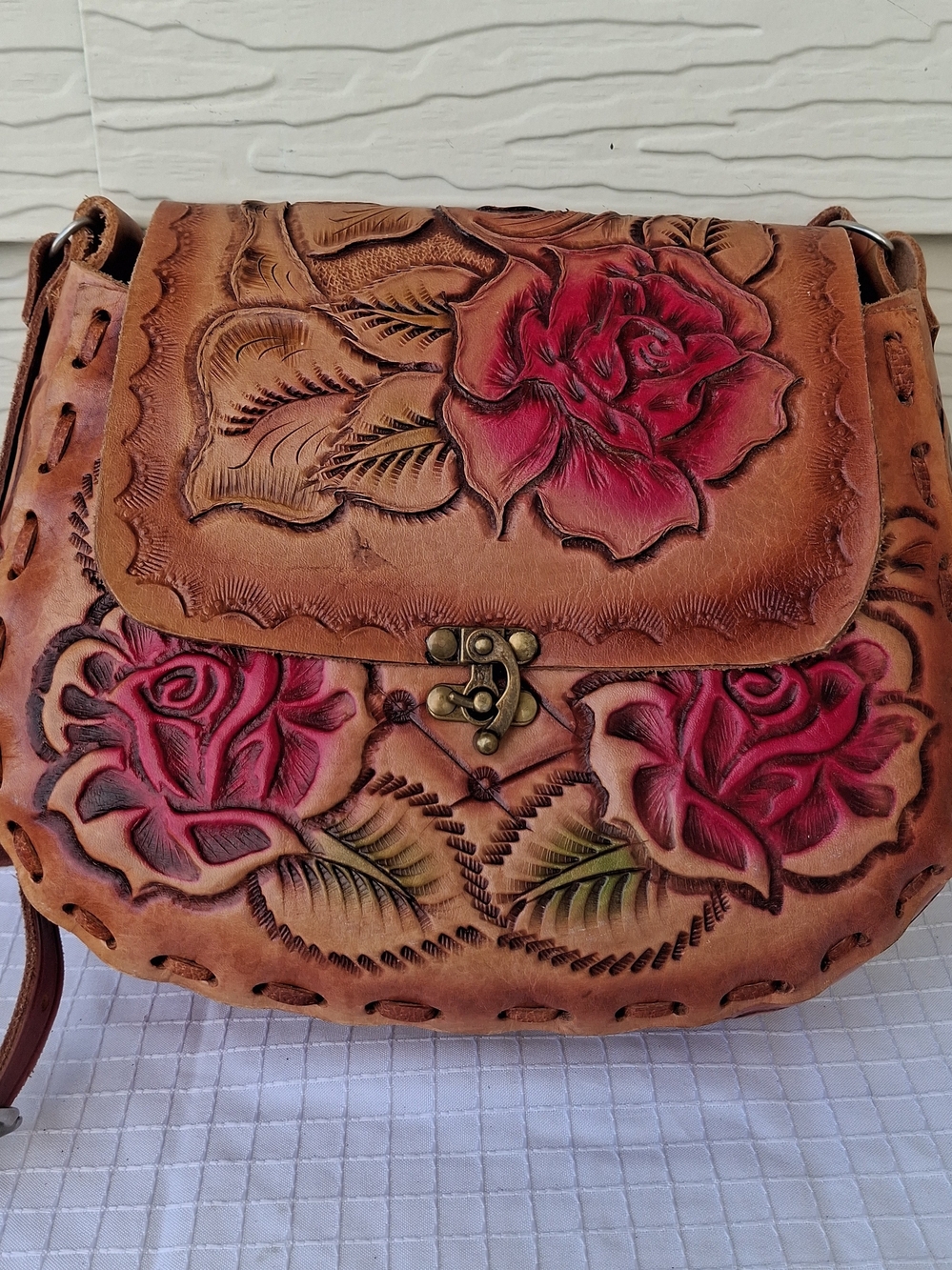 Hand-Tooled Floral Leather Crossbody Bag in Brown with Red Accents